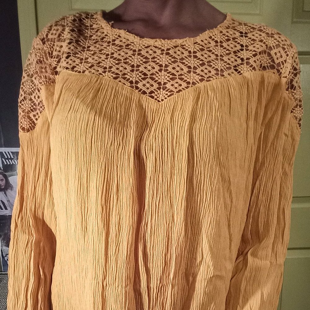 beautiful yellow billowy long sleeve blouse.